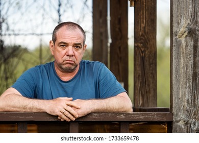 Sad pensive wrinkled man outdoors portrait. Real people