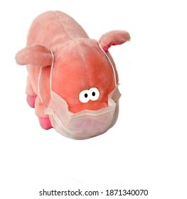 Sad Piglet. Toy With Medical Mask On White Background