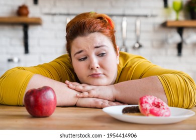 Sad plump fat woman choosing between sweets and fruits, healthy eating and junk food. The choice. Two options. The choice between eating. Delema, for a healthy lifestyle or not.