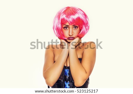 Sad pop girl portrait wearing latex dress and pink wig
