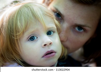 Sad Portrait Of Mother And Daughter - Outdoor