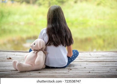 Sad Pre Teen Girl Lives In Countryside Feel Alone With Her Best Friend Teddybear.