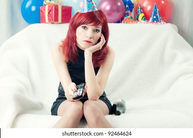 Sad Red-haired Party Woman Sitting At Home And Watching TV