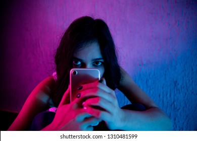 sad and scared female teenager with computer laptop suffering cyberbullying and harassment being online abused by stalker or gossip feeling desperate and humiliated in cyber bullying