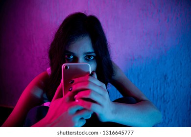 Sad And Scared Female Teenager With Computer Laptop Suffering Cyberbullying And Harassment Being Online Abused By Stalker Or Gossip Feeling Desperate And Humiliated In Cyber Bullying