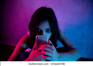 sad and scared female teenager with computer laptop suffering cyberbullying and harassment being online abused by stalker or gossip feeling desperate and humiliated in cyber bullying