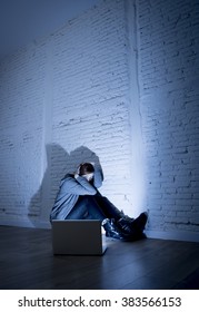 Sad And Scared Female Teenager With Computer Laptop Suffering Cyberbullying And Harassment Being Online Abused By Stalker Or Gossip Feeling Desperate And Humiliated In Cyber Bullying Concept