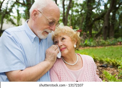 Sad Senior Couple In Grieving The Loss Of A Loved One.