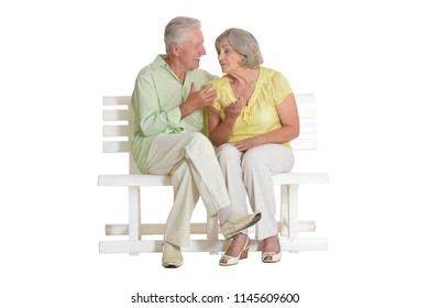 Sad Senior Couple Sitting On Bench