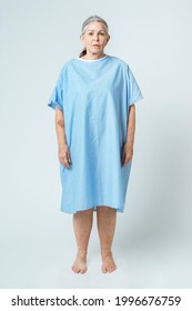 Sad Senior Patient In A Hospital Gown