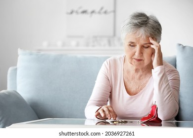 Sad Senior Woman Counting Money At Home