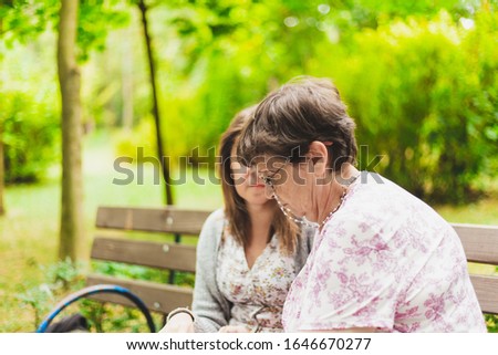 Similar – Senior dissatisfied woman in a wheelchair with her daughter