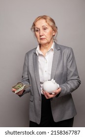 Sad Senior Woman With Us Dollars Money