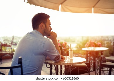 Sad single romantic man waiting for his date