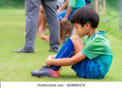 Sad Soccer Kid Sitting On Field Side Substitution Bench Doesn't Get To Play In A Competition Match