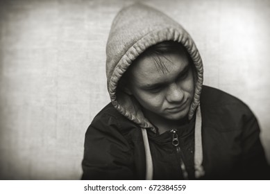 Sad teenager boy close-up