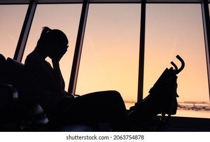 Sad, Tired, Crying Mother At Airport Terminal 