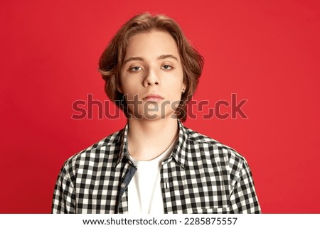 Sad, tired, exhausted. Close up portrait of young boy wearing checkered shirt looking at camera with emotionless facial expression. Concept of human emotions, mood, psychological condition, beauty, ad Stock photo © 