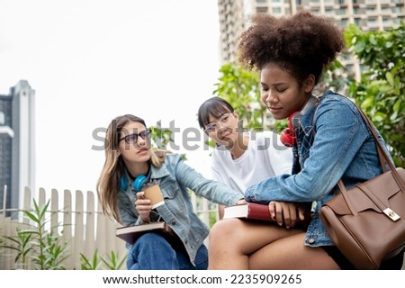 Sad tired young woman having headache migraine or depression, upset frustrated girl troubled with problem feel. Diversity of student at park. University education flunk a test.