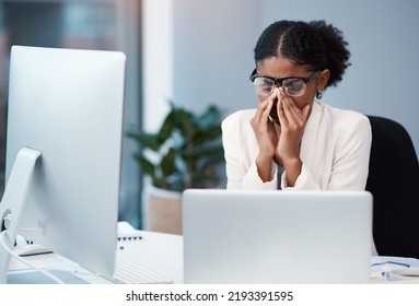 Sad Unhappy Business Woman With Headache, Migraine Or Burnout Working On A Computer In An Office Alone At Work. One Tired, Anxious And Frustrated Corporate Female Boss Looking Exhausted And Upset