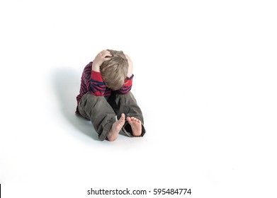 Sad And Unhappy Child. Upset Toddler Boy. Problem Child With Head In Hands. Concept For Bullying, Depression Stress Or Frustration. Isolated On White Background. Scared Or Terrified Child. 