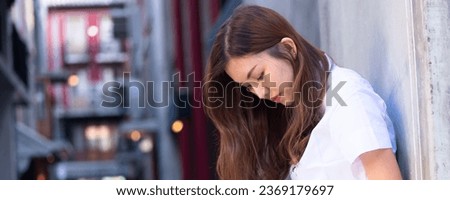 Sad, unhappy and depressed asian woman