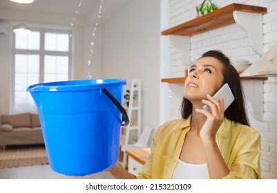 Sad Unhappy Frustrated Young Housewife Lady Looking Up At Water Falling Down From Damaged Ceiling In Newly Renovated Home Interior, Holding Pail And Speaking To Repair Service. House Roof Leak Concept