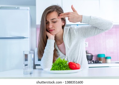 Sad Unhappy Woman Is Tired Of Dieting, Exterminate Yourself With A Diet And Forcing Yourself To Eat Organic, Clean Healthy Food