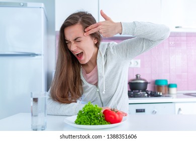 Sad Unhappy Woman Is Tired Of Dieting, Exterminate Yourself With A Diet And Forcing Yourself To Eat Organic, Clean Healthy Food