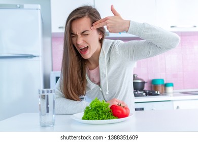 Sad Unhappy Woman Is Tired Of Dieting, Exterminate Yourself With A Diet And Forcing Yourself To Eat Organic, Clean Healthy Food