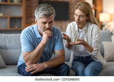 Sad upset adult caucasian wife yelling at husband, gesticulates in living room interior, close up. Bad news, stress, quarrel at home, relationship problems, conflict and people emotions due covid-19 - Shutterstock ID 2191048695