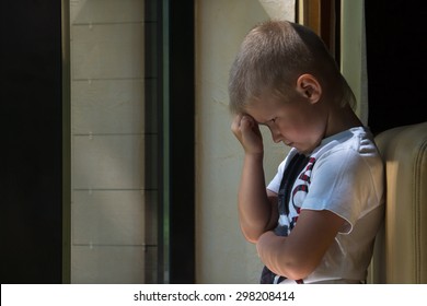 Sad Upset Waiting Boring Depressed Child (boy) Near A Window