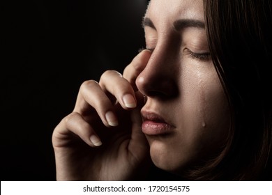 Sad Woman With Closed Eyes Crying, On Black Background, Closeup Portrait, Side View