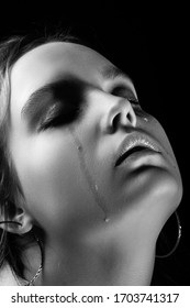 Sad Woman Crying With Closed Eyes On Black Background, Closeup Portrait, Monochrome