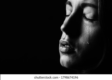 Sad Woman Crying On Black Background, Closeup Portrait, Monochrome