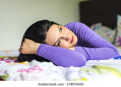 Sad Woman Dreaming With Open Eyes And Lying In Bed