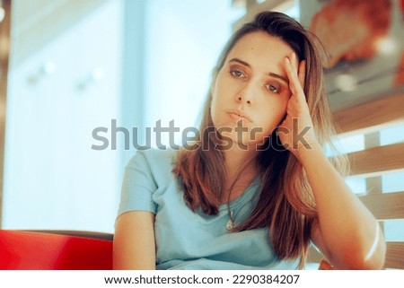 
Sad Woman Feeling Depressed and Bored Sitting Alone. Unhappy anxious girlfriend waiting in a restaurant 
