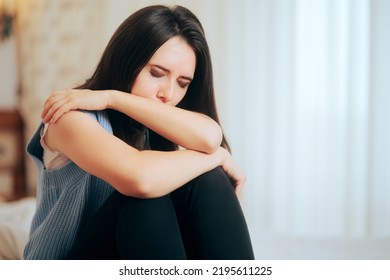 
Sad Woman Feeling Depressed Crying At Home. Lonely Person Feeling Empty On The Inside Suffering From Traumatic Events
