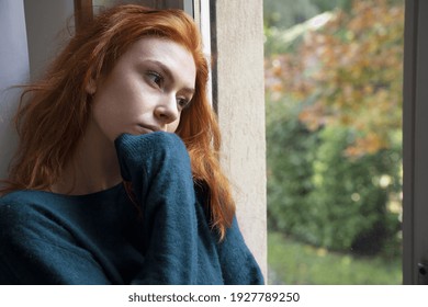 Sad woman feeling negative emotions alone at home