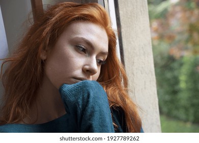 Sad woman feeling negative emotions alone at home