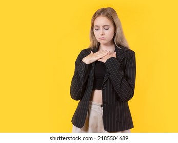 Sad Woman. Girl Stands With Her Eyes Closed. Upset Blonde Woman. Girl In Black Jacket. Young Woman Is Upset. Model Blonde Looks Down. Lady Suffers Because Of Trouble. Upset Female Student On Yellow