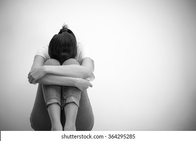 Sad Woman Hug Her Knee And Cry (monochrome)