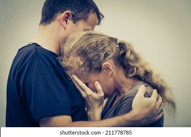Sad Woman Hugging Her Husband