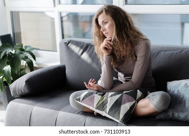 Sad Woman Locating On Comfortable Couch