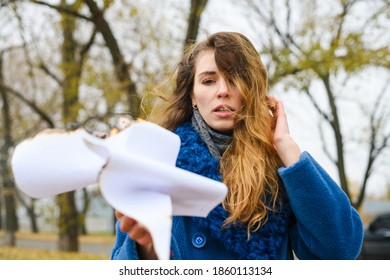 Sad Woman Look At Burning Paper Outdoors