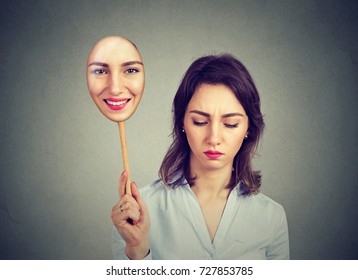 Sad Woman Looking Down Taking Off Happy Mask Of Herself 