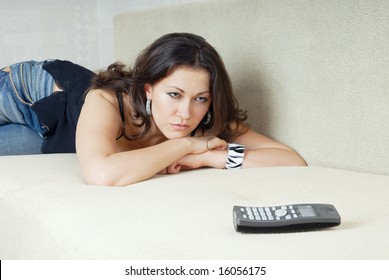 Sad woman looking at the phone and waiting call