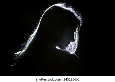 Sad Woman Profile Silhouette In Dark