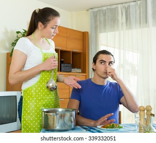 Sad Woman Serving Food Her Beloved Man At Table