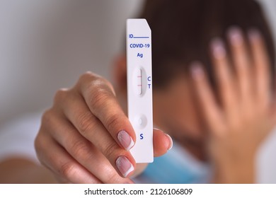 Sad Woman Showing Rapid Covid Antigen Test Or Express Covid Test With Positive Coronavirus Result. Woman With Covid-19 Infection